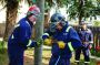 Supreme Vac’s Bryce Jeske, left, helps Ryan Dorchak with the stinger wand while on a job. Looking on is Dan Lin.