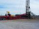 A portable pipe pickup and laydown machine manufactured by Pipehandler Oilfield Systems and owned by Longhorn Tubular Services in New Mexico sits on a job site. The machine can handle pipes up to 5 1/2 inches in diameter and up to 2,500 pounds.  (Photos courtesy of Longhorn Tubular Services)